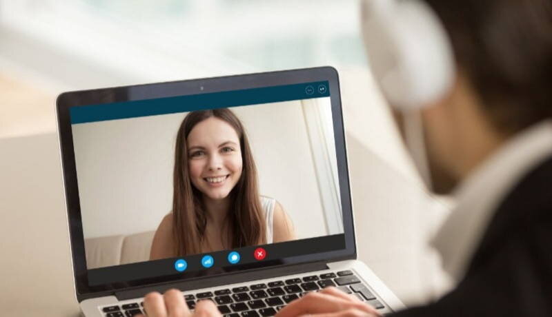 Woman on skype looking happy